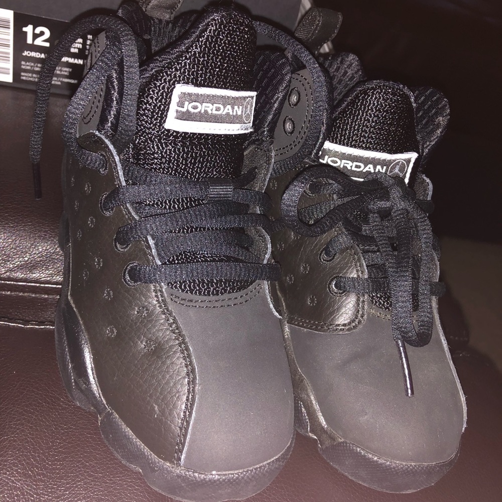 Kids black Jordan sneakers size 11.